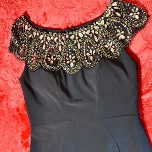 Xscape body-con dress. Beaded Illusion Neckline.